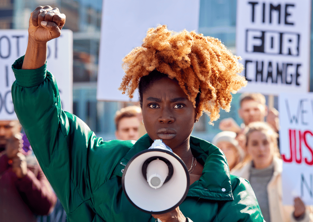 Protestors with Placards and Megaphone on Black Lives Matter Demonstration March against Racism