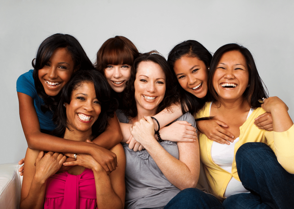 Diverse group of mothers and daughters smiling