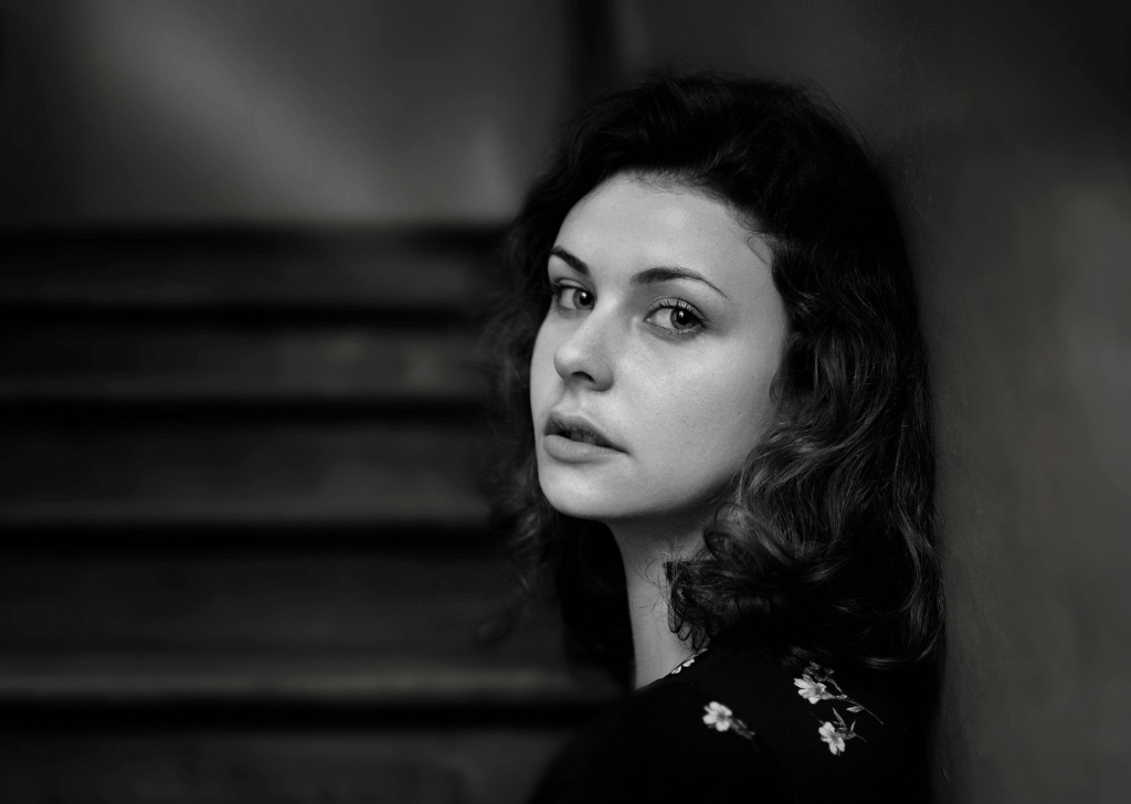 Young woman in a stairwell after Title X funding cut