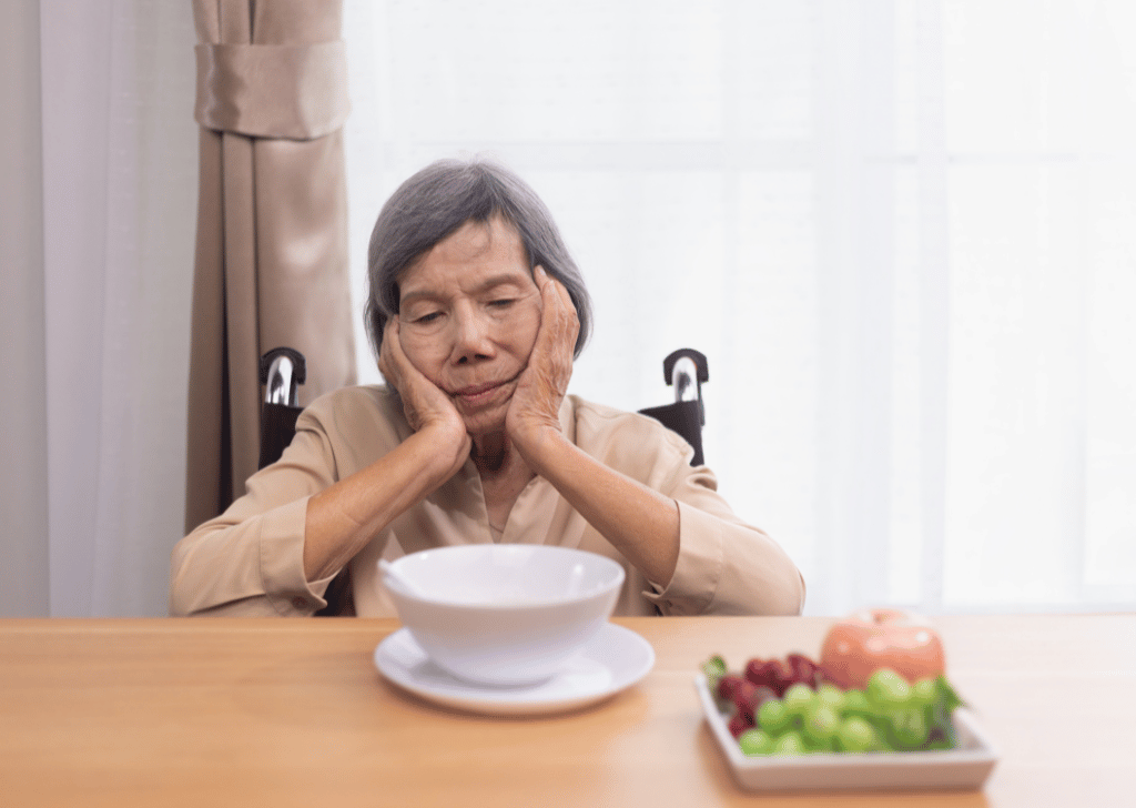 Senior woman looking at an empty bowl
