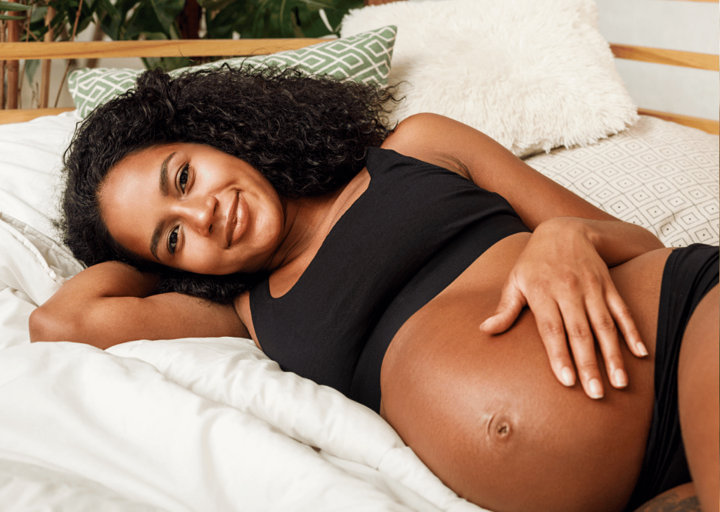 Pregnant Black Woman Lying on Her Side