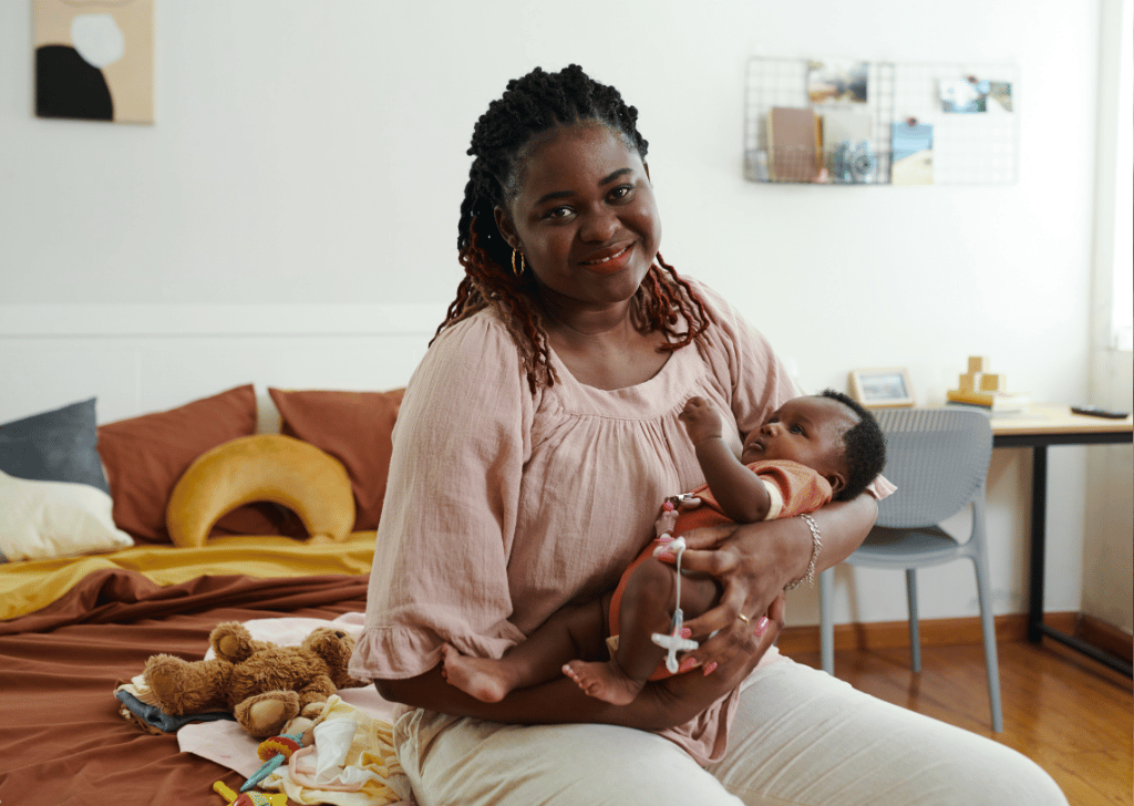 Black Mom Rocking Baby to Sleep