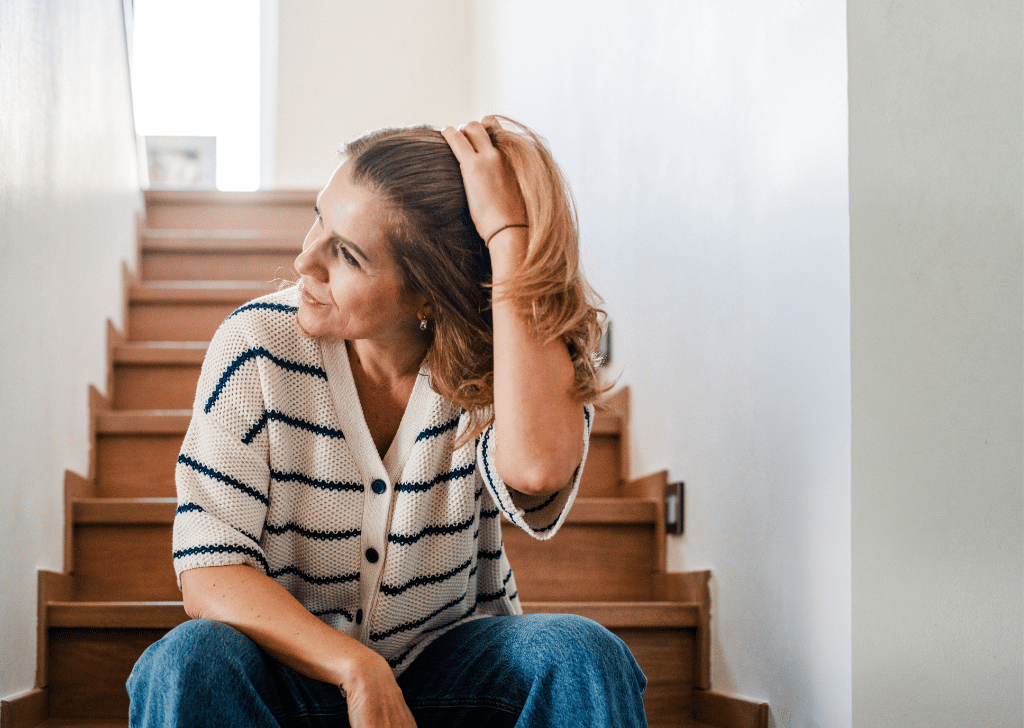 Woman resting on stairs