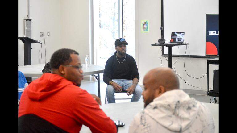 James Hogue teaching expecting fathers and non-birthing partners how to be active participants in childbirth