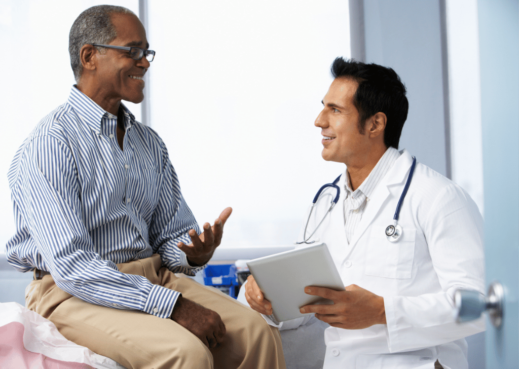 Doctor discussing hormone test results with Black male patient